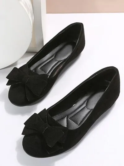 Effen kleur slip-ons met ronde neus en strik