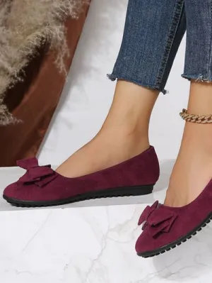 Effen kleur slip-ons met ronde neus en strik