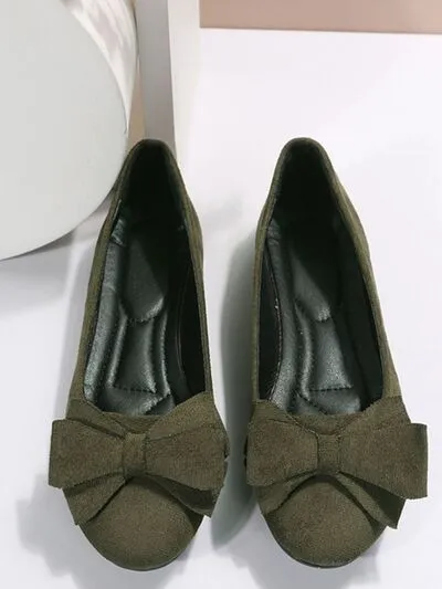 Effen kleur slip-ons met ronde neus en strik