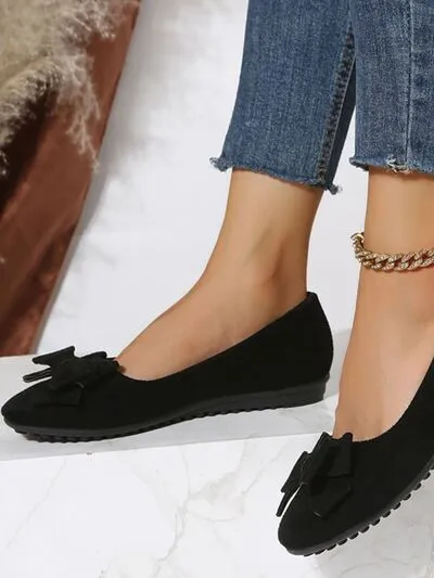 Effen kleur slip-ons met ronde neus en strik
